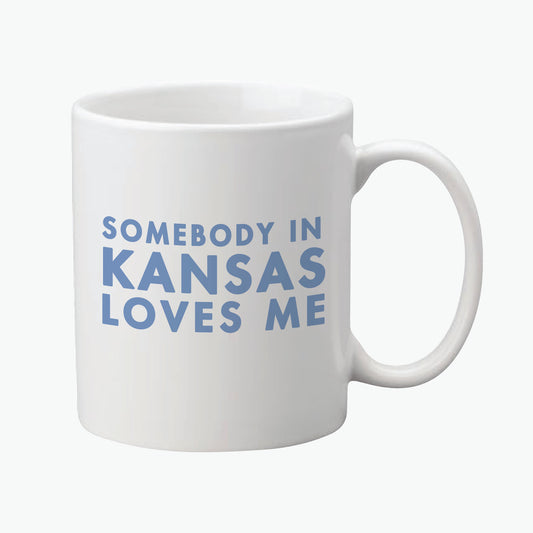 Somebody in Kansas Love Me Ceramic Mug