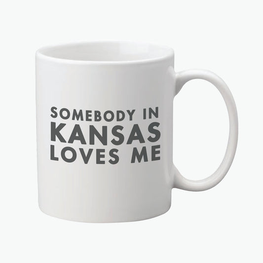 Somebody in Kansas Love Me Ceramic Mug